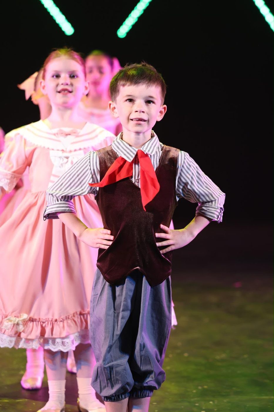 Young dancer in character costume with a red neckerchief